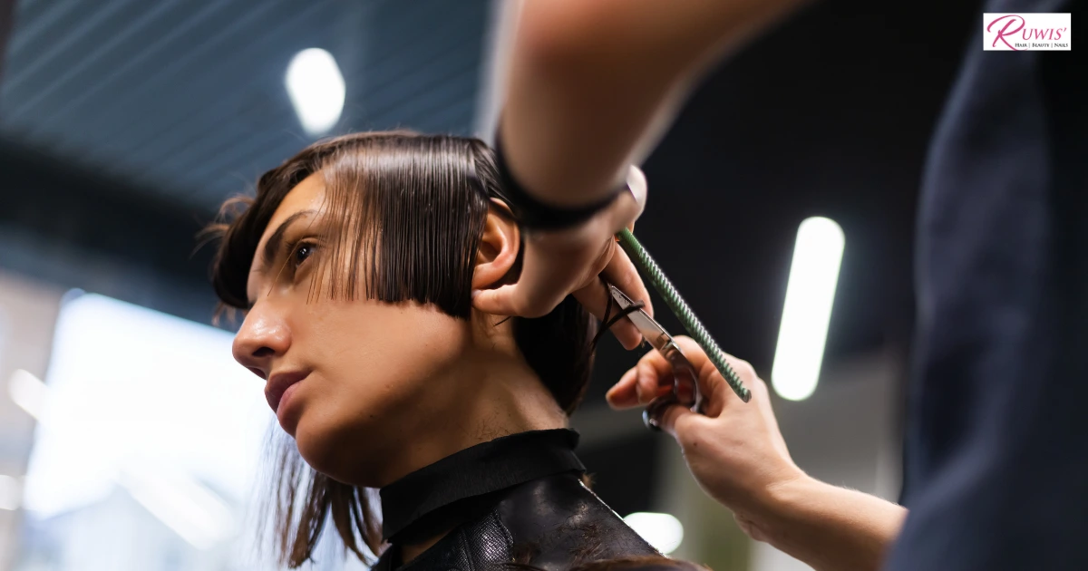 Seasonal hair-cutting services in Winnipeg, MB, showing a stylist cutting hair in a modern salon.